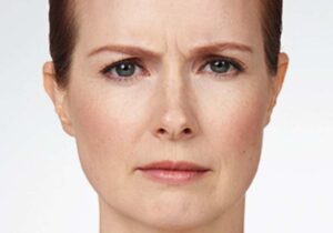 a woman frowning