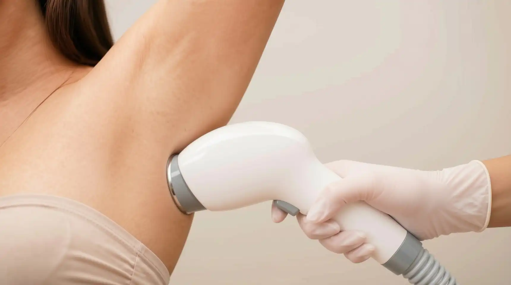 Diode laser handpiece held near a client's underarm
